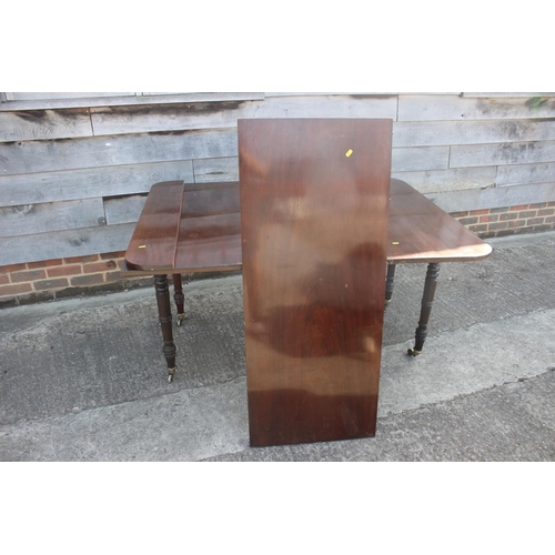 613 - A 19th century mahogany extending dining table with extra leaf, on slender turned and castored suppo... 