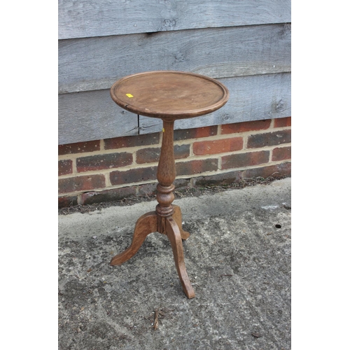 675 - A mahogany wine table, on turned column and tripod support, 11 1/2