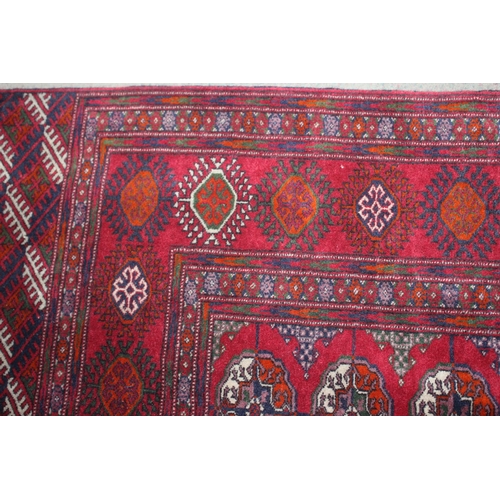 727 - A Bokhara rug of traditional design with seventy-five medallions and multi-borders, 112