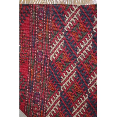 727 - A Bokhara rug of traditional design with seventy-five medallions and multi-borders, 112