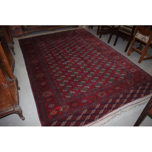 727 - A Bokhara rug of traditional design with seventy-five medallions and multi-borders, 112