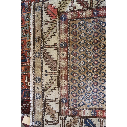 737 - A tribal runner with all-over boteh design on a camel ground and two geometric borders, in shades of... 