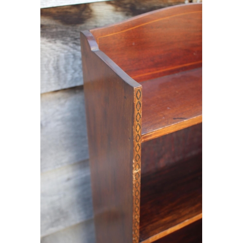 639 - An Edwardian mahogany and inlaid open bookcase, 16