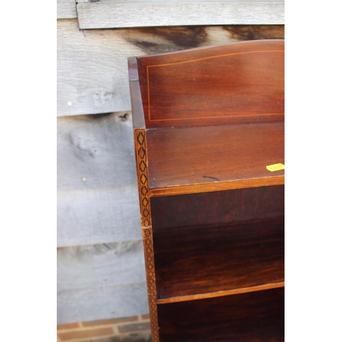 639 - An Edwardian mahogany and inlaid open bookcase, 16