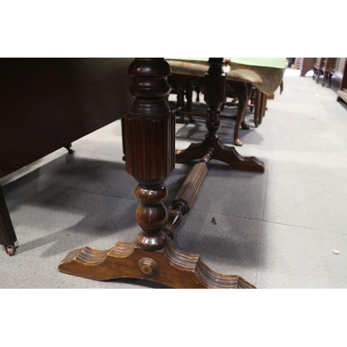 718 - An early 20th century mahogany extending dining table with extra folding centre leaf and Wabash tabl... 