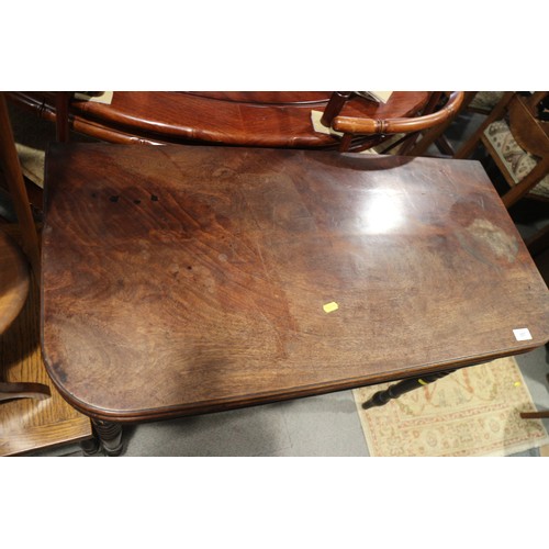 557 - A 19th century mahogany 'D' shape fold-over top card table, on turned and tapering supports, 36