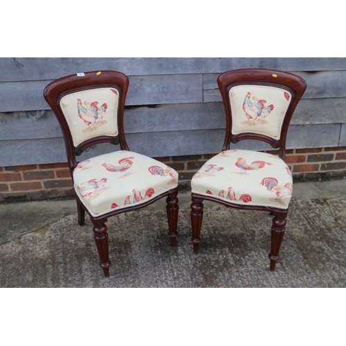 611 - A set of six late Victorian mahogany showframe chairs with padded backs and stuffed over seats, upho... 