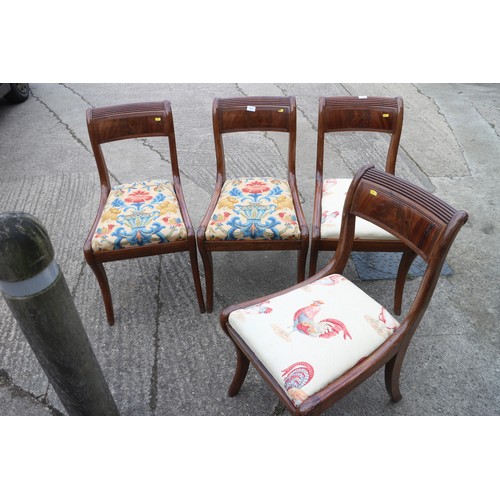 612 - A set of four early 19th century mahogany reeded top rail standard dining chairs with drop-in seats,... 