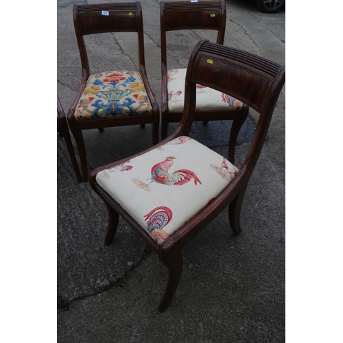 612 - A set of four early 19th century mahogany reeded top rail standard dining chairs with drop-in seats,... 