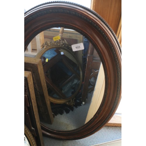 623 - A polished as walnut oval framed wall mirror, plate 26