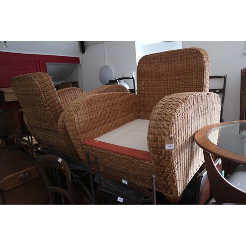 648 - A pair of 1930s design square arm rattan armchairs, on bun feet