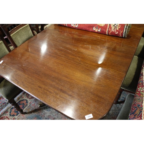 654 - A William Tillman mahogany extending double pedestal dining table with reeded edge and two extra lea... 