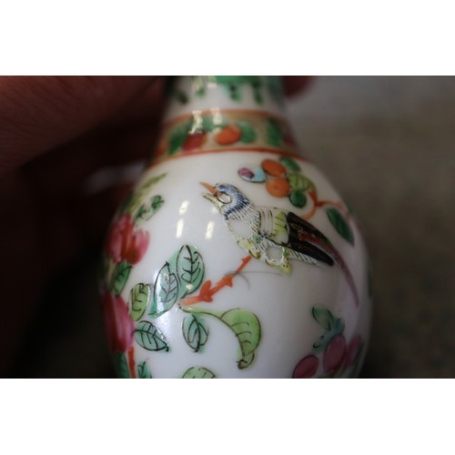 122 - A Cantonese famille verte baluster vase, decorated panels with figures, 10