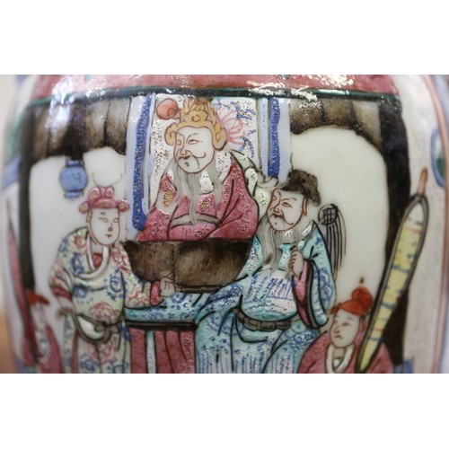 122 - A Cantonese famille verte baluster vase, decorated panels with figures, 10