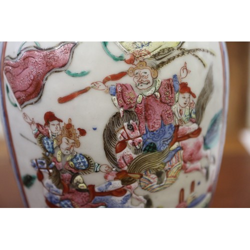 122 - A Cantonese famille verte baluster vase, decorated panels with figures, 10