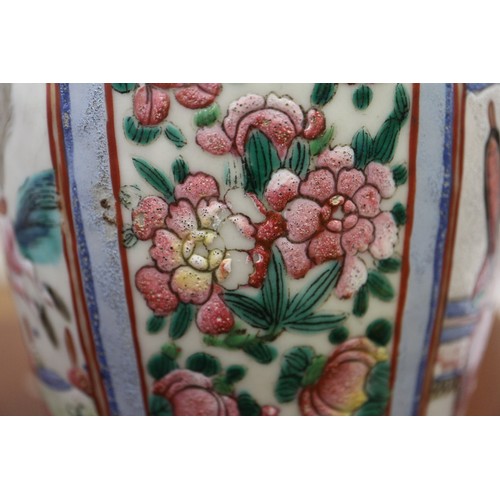 122 - A Cantonese famille verte baluster vase, decorated panels with figures, 10