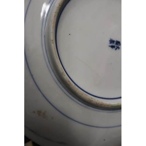 129 - A Chinese floral decorated dish on a blue and yellow ground, 9 1/4