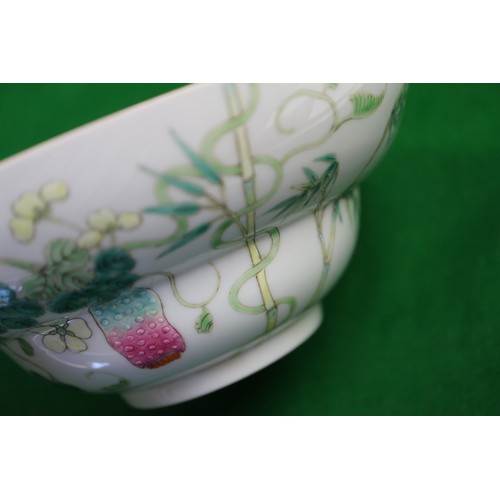 138 - A Chinese famille verte bowl, decorated strawberries, insects and foliage, six-character mark to bas... 