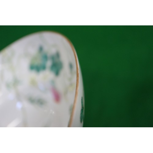 138 - A Chinese famille verte bowl, decorated strawberries, insects and foliage, six-character mark to bas... 