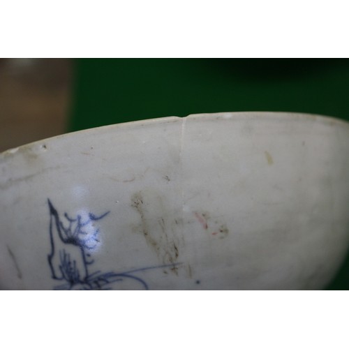 139 - A Chinese blue and white bowl, decorated figures in a landscape, six-character mark to base, 6