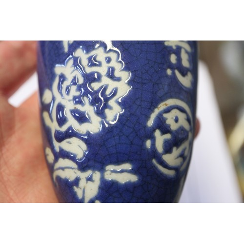 146 - A Chinese drum-shaped pot and cover with two panels decorated figures in landscapes on a blue glaze ... 