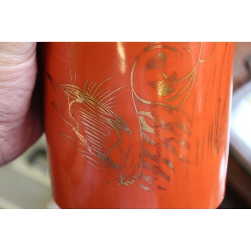 147 - A Chinese cylindrical vase with gilt highlighted birds in foliage decoration on an orange ground, se... 