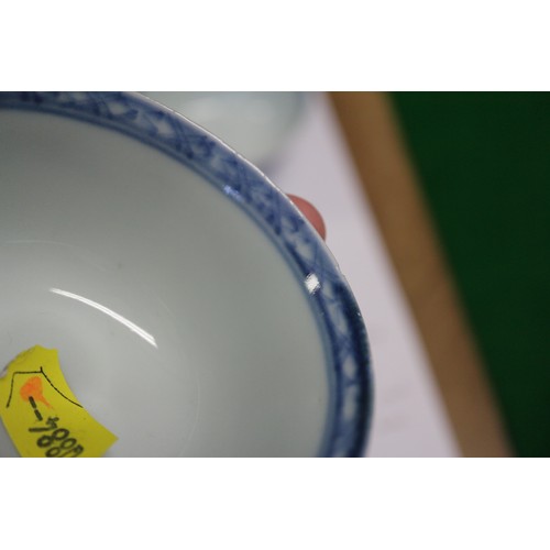 149 - Three Nanking cargo tea bowls and saucers with blue and white landscape decoration, and 