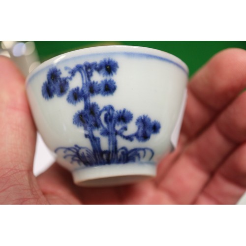 149 - Three Nanking cargo tea bowls and saucers with blue and white landscape decoration, and 