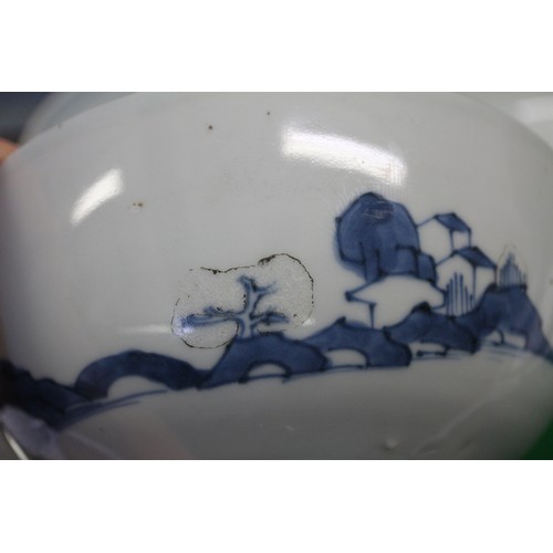 150 - Three Nanking cargo bowls with blue and white landscape decoration, 6 1/2