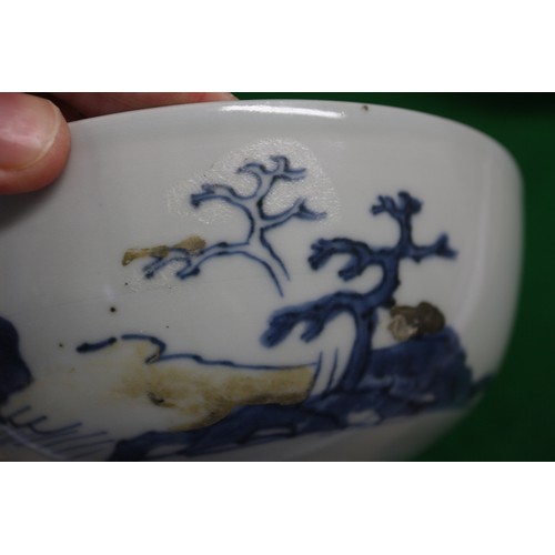 150 - Three Nanking cargo bowls with blue and white landscape decoration, 6 1/2