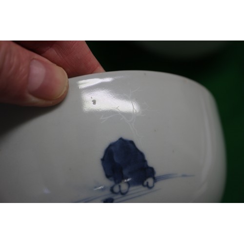 150 - Three Nanking cargo bowls with blue and white landscape decoration, 6 1/2