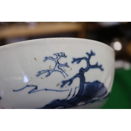 150 - Three Nanking cargo bowls with blue and white landscape decoration, 6 1/2