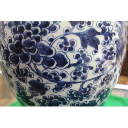 154 - A Chinese porcelain blue and white phoenix decorated jar, 13 1/2