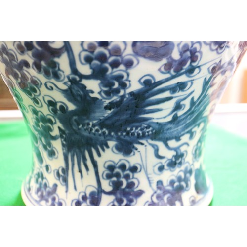 154 - A Chinese porcelain blue and white phoenix decorated jar, 13 1/2