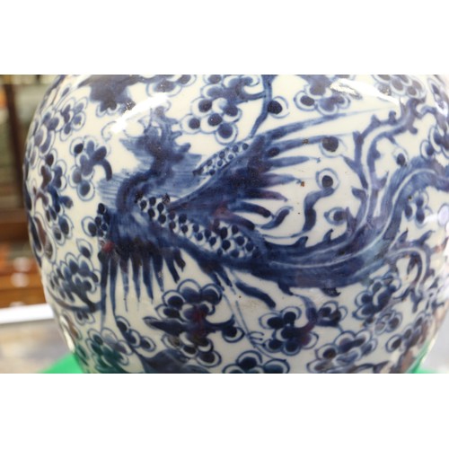 154 - A Chinese porcelain blue and white phoenix decorated jar, 13 1/2