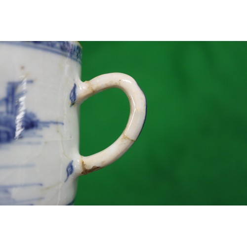 156 - A Chinese blue and white mug with building in landscape decoration (restored and cracked), a blue an... 