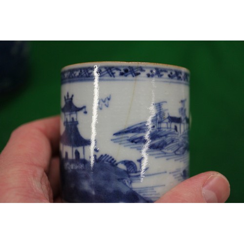 156 - A Chinese blue and white mug with building in landscape decoration (restored and cracked), a blue an... 