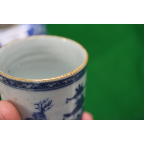 156 - A Chinese blue and white mug with building in landscape decoration (restored and cracked), a blue an... 