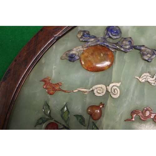 168 - A Chinese circular jade and hardstone inlaid table screen, on carved and pierced stand, 21 1/2