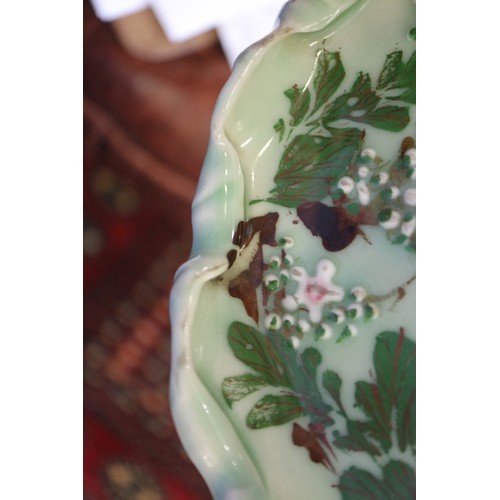 124 - A Chinese Yixing pottery teapot with Dog of Fo finial (chip to spout), a celadon glazed dish, decora... 