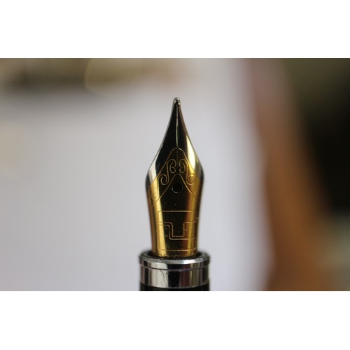 278 - A gold coloured Parker fountain pen, a rolled gold propelling pencil and a Burnham fountain pen