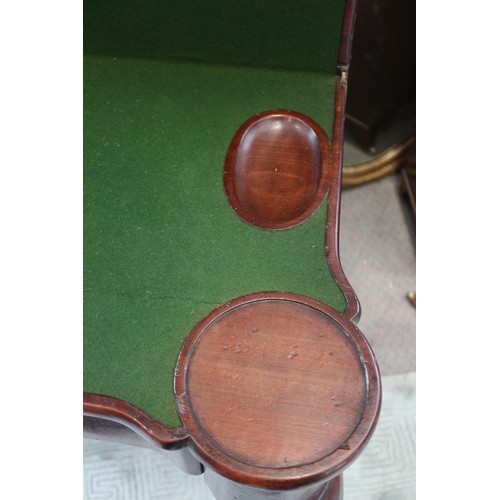 546 - An early George III mahogany fold-over top card table with counter wells and single gate, on shaped ... 