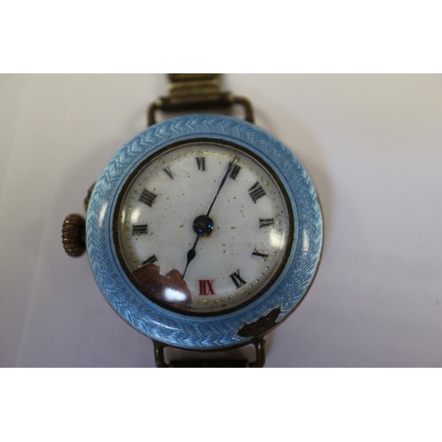 420 - A lady's rolled gold and enamelled wristwatch, an Art Deco style silver cased wristwatch, a WWI Vict... 