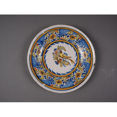 5 - A 19th century Portuguese polychrome decorated faience shallow dish, maker's mark VM D, 13 3/4