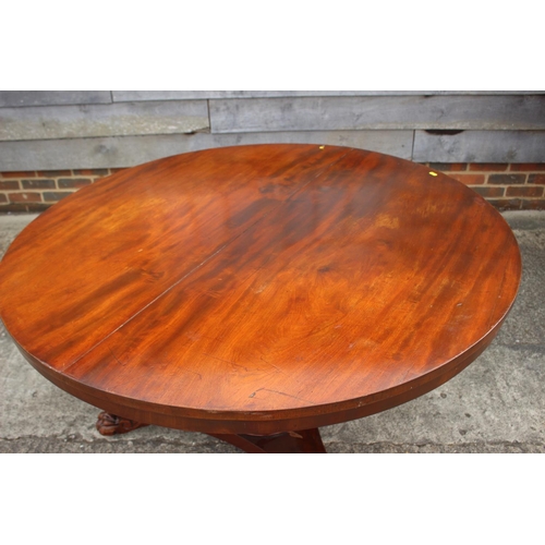 494 - A 19th century mahogany circular dining table, on faceted column triform base with lion paw feet, 47... 