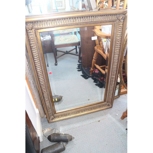 539 - A wall mirror in deep fluted frame with bevelled plate, 30