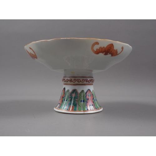 105 - A Chinese porcelain stem bowl, decorated foliage, and characters and bats to the underside, 5 1/2