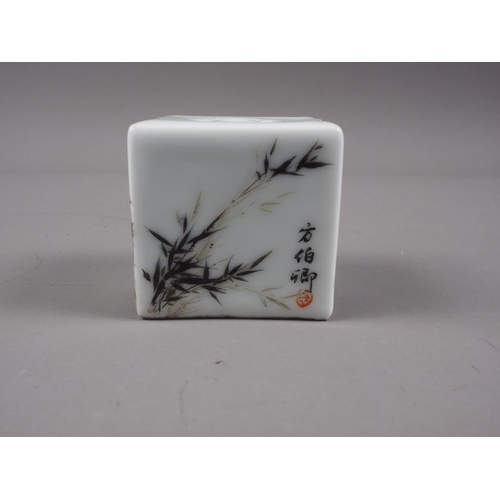 106 - A Chinese porcelain incense cube decorated foliage and characters, 1 3/4