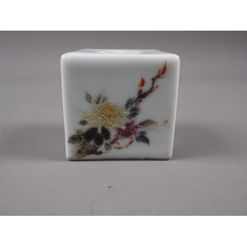 106 - A Chinese porcelain incense cube decorated foliage and characters, 1 3/4