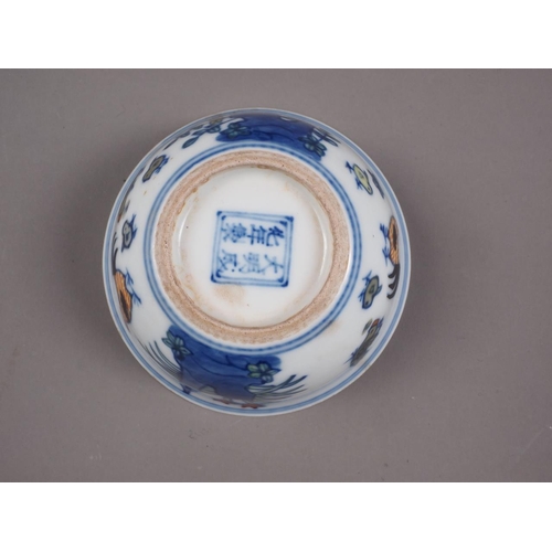 108 - A Chinese porcelain Ducai tea bowl, decorated chickens, six-character mark to base, 3 1/4